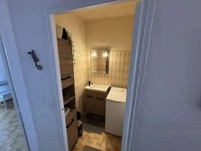 a small bathroom with a sink and a mirror at Appartement 2 pièces - 5 couchages Port la Nouvelle PN440-023 in Port-la-Nouvelle