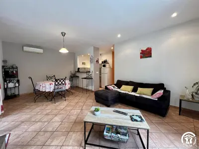a living room with a couch and a table at Le gite du pech de saint jean in La Redorte
