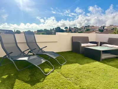 a bedroom with a bed and a large window at T3 lumineux - Terrasse- Proche des grands buffets in Narbonne