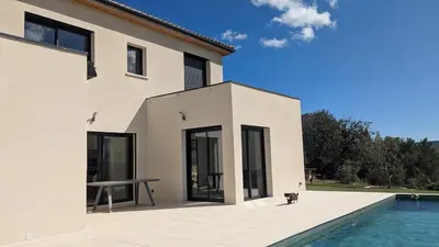 a house with a cat sitting next to a swimming pool at Oxyzenvilla 11200 Saint-André-de-Roquelongue in Saint-André-de-Roquelongue