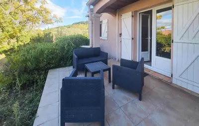 a patio with chairs and a table on a house at Pet Friendly Home In Saint Chinian With Wifi in Saint-Chinian