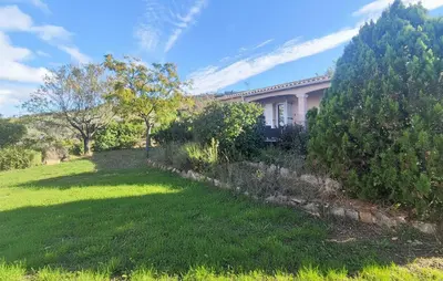 a house with a green lawn in front of it at Pet Friendly Home In Saint Chinian With Wifi in Saint-Chinian