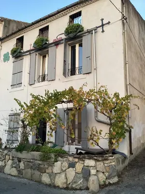 a building with a cross on the side of it at Apartment for 2 in Embres in Embres-et-Castelmaure