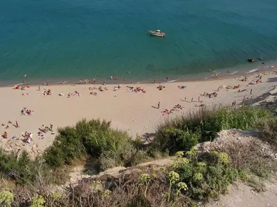a group of people on a beach near the water at Apartment for 2 in Embres in Embres-et-Castelmaure