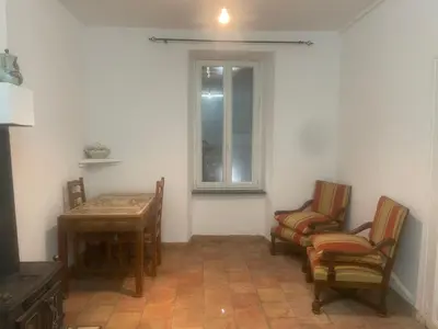 a room with chairs and a table and a window at Apartment for 2 in Embres in Embres-et-Castelmaure