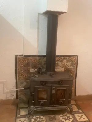 a stove sitting on the floor in a room at Apartment for 2 in Embres in Embres-et-Castelmaure
