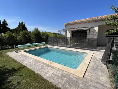 a swimming pool in the backyard of a house at Villa la garrigue in Boutenac
