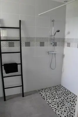 a shower with a glass door in a bathroom at Villa la garrigue in Boutenac
