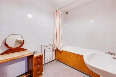 a bathroom with a tub and a sink and a mirror at Chateau st-auriol - la bergerie in Lagrasse