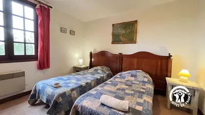 a bedroom with two beds and a window at Chateau st-auriol - magnanerie in Lagrasse