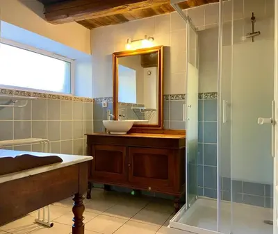 a bathroom with a sink and a mirror at Maison accueillante à Le Soulié avec jardin in Le Soulié
