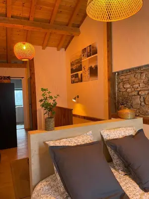 a living room with a couch and a table at Petite maison au centre de Mirepoix in Mirepoix
