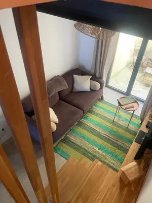 an overhead view of a living room with a couch at Petite maison au centre de Mirepoix in Mirepoix