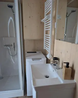 a bathroom with a sink and a toilet and a shower at Localodge in Caves