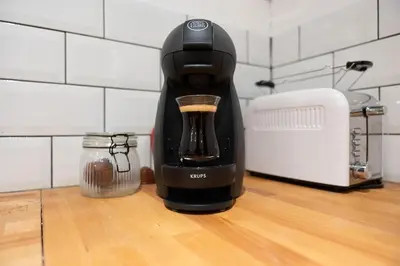 a black coffee maker sitting on a counter next to a blender at Darja in Carcassonne