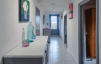 a kitchen with a counter with vases on it at 2 Bedroom Awesome Home In Pardailhan in Pardailhan