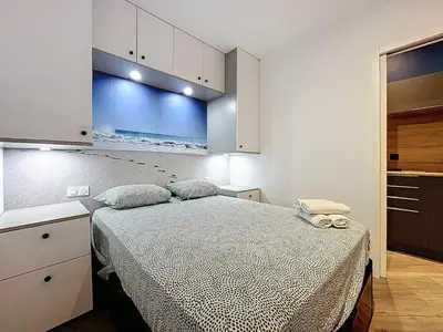 a bedroom with a bed in a room at la loge des halles - clim - 50m des halles in Narbonne