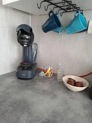 a kitchen counter with a coffee maker and a bowl of food at Spacieux duplex sur le port in Gruissan