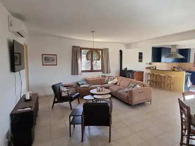 a living room with a couch and a table at Relaxing Retreat Near Minerve in Aigne