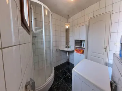 a bathroom with a shower and a sink at Relaxing Retreat Near Minerve in Aigne