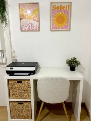a white desk with a laptop and a chair at La villa du soleil in Lapalme