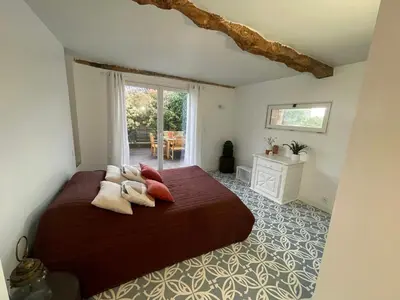 a bedroom with a bed with pillows on it at Spacious Villa With Pool Near Carcassonne in Soupex