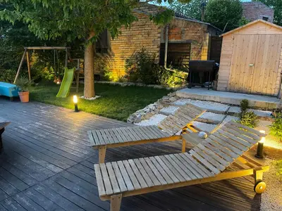 a backyard with two wooden benches and a playground at Spacious Villa With Pool Near Carcassonne in Soupex