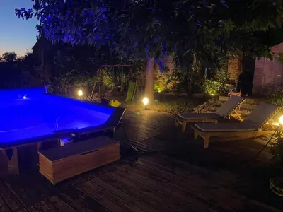 a swimming pool in a backyard at night at Spacious Villa With Pool Near Carcassonne in Soupex