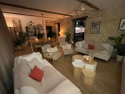 a living room with two white couches and a table at Spacious Villa With Pool Near Carcassonne in Soupex