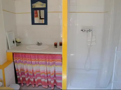 a bathroom with a sink and a shower at La Maison Bleue de Sigean - Loft 1 in Sigean