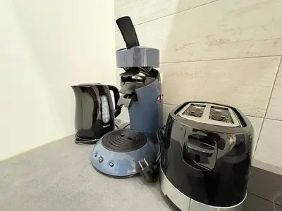 a blender and a toaster sitting on a counter at L'Atelier Bohème - Studio élégant en centre ville in Pamiers