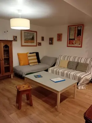 a living room with a couch and a coffee table at Grande maison 7 places in Paziols