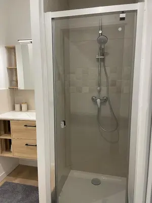 a shower with a glass door in a bathroom at Studio rénové pour 2 personnes - centre ville in Carcassonne