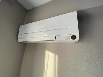 a white appliance is hanging on a wall at L'écume d'or T3 in Port-la-Nouvelle