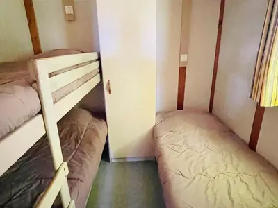 a small room with two bunk beds in it at Chalet avec Terrasse à Camon - API-1-52-902 in Camon