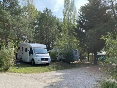 a white truck parked next to a camp site at Bungalow 3 Pièces avec Terrasse - API-1-52-888 in Camon