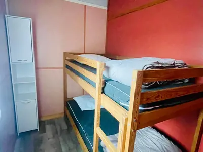 a couple of bunk beds in a room at Chalet 8 pers avec Terrasse - API-1-52-1027 in Camon