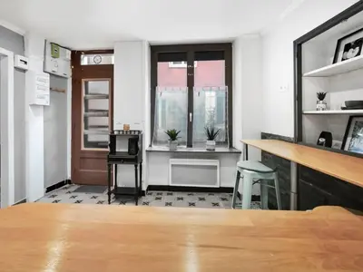 a room with a bar and a tv in it at Suite Privative Design au Cœur de Trèbes in Trèbes