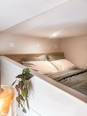 a bedroom with a bed in a room at Le Jardin, studio façon nature in Castres