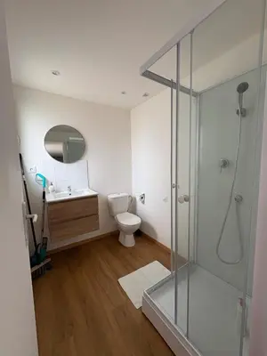 a bathroom with a shower and a toilet and a sink at Charles de Gaulle lll - Independent Garden in Castres