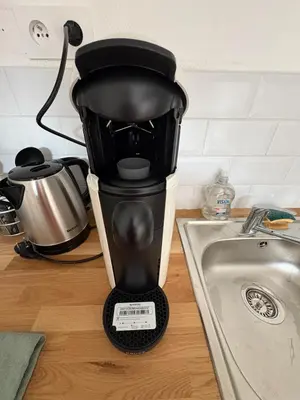 a coffee maker sitting on a counter next to a sink at Charles de Gaulle lll - Independent Garden in Castres
