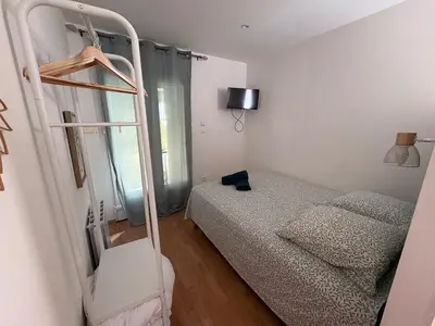 a bedroom with a bunk bed and a ladder at Charles de Gaulle lll - Independent Garden in Castres