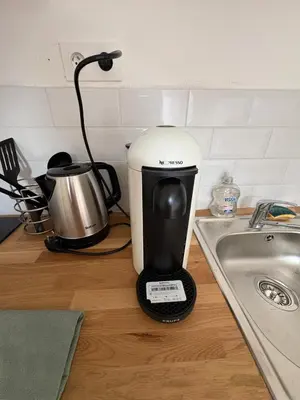 a coffee maker sitting on a counter next to a sink at Charles de Gaulle lll - Independent Garden in Castres