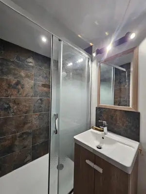 a bathroom with a shower and a sink and a toilet at Small fortress of Salses-le-Château climatisation de 1 à 8 in Salses-le-Chateau