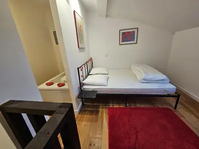 two twin beds in a room with at Small fortress of Salses-le-Château climatisation de 1 à 8 in Salses-le-Chateau