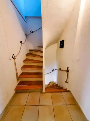 a stairway with a set of stairs in a building at La Tomette 3 chambres avec joli patio in Sigean