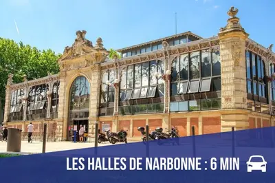 a large building with motorcycles parked in front of it at Gîte Piscine in Narbonne
