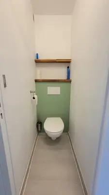 a small bathroom with a toilet in a room at Le Tropical in Port-la-Nouvelle
