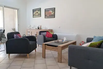 a living room with couches and a coffee table at La Glycine in Portel-des-Corbières