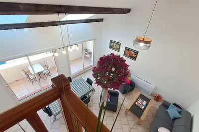an overhead view of a living room and dining room at La Glycine in Portel-des-Corbières